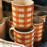 Hand-painted 16 oz stoneware mug with a decorative pattern, one of three available styles