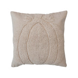 An 18 inch square cream-colored cotton slub tufted pillow with a pumpkin motif and chambray back