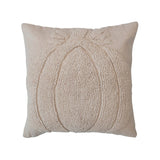 An 18 inch square cream-colored cotton slub tufted pillow with a pumpkin motif and chambray back