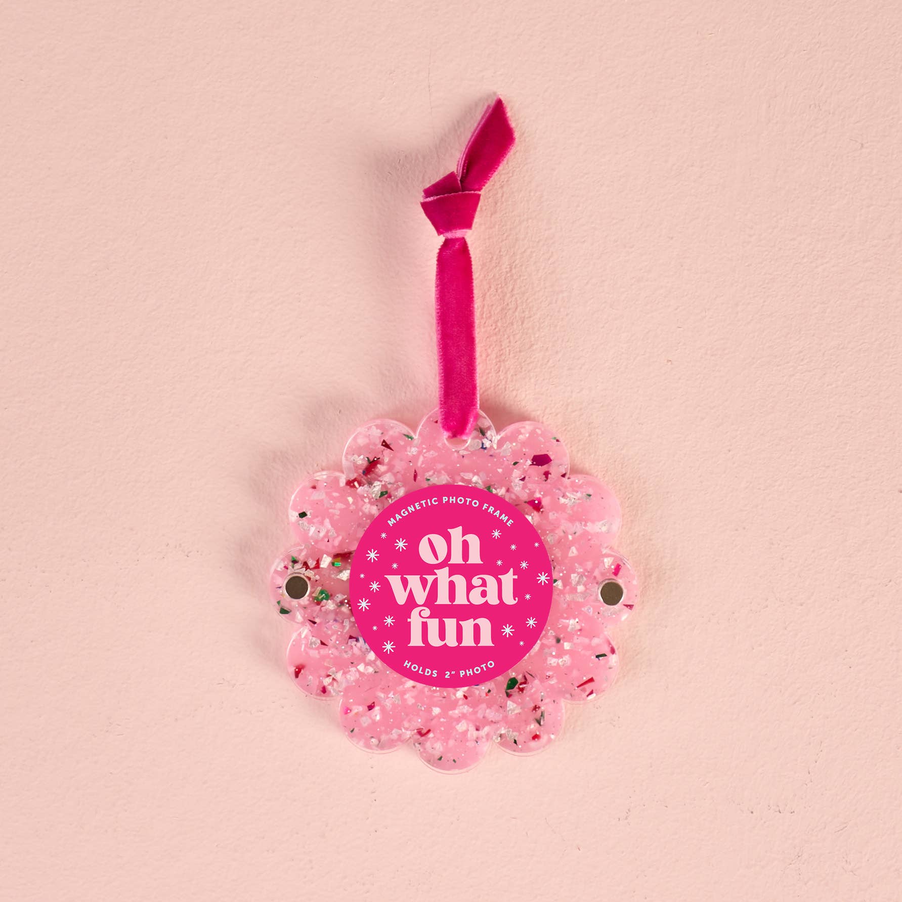 Pink photo frame with 'oh what fun' text on a pink background