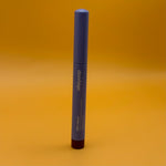 Blue cosmetic pencil with 'alleyoop' branding on a yellow background