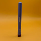 Blue cosmetic pencil with 'alleyoop' branding on a yellow background