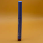 Blue cosmetic tube with 'Alleyoop' branding on an orange background