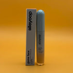 Alleyoop game face concealer go getter bottle and packaging on an orange background
