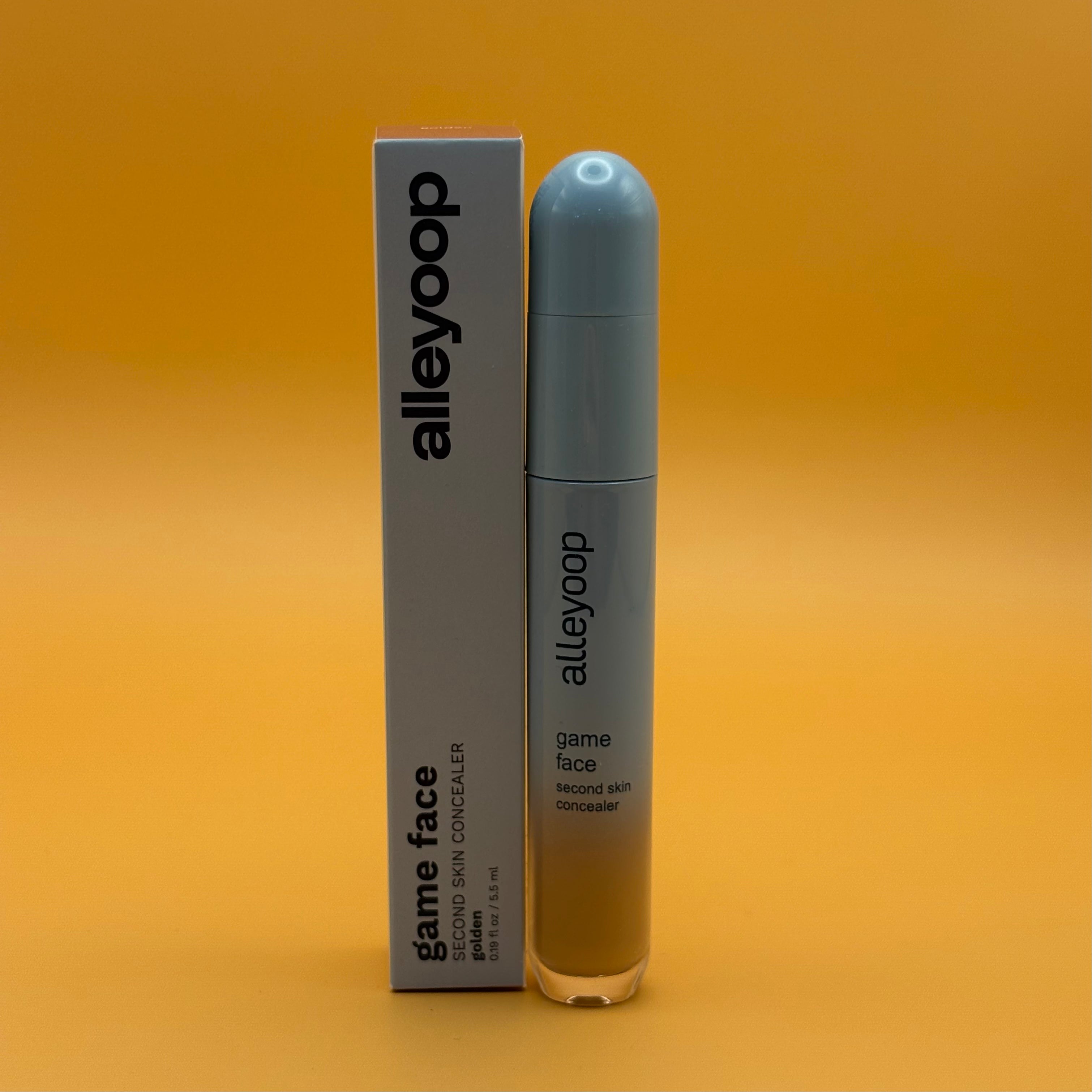 Alleyoop game face product golden with packaging on an orange background