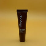 Tube of alleyoop lip balm on a yellow background