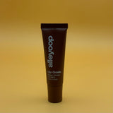 Tube of alleyoop lip balm on a yellow background
