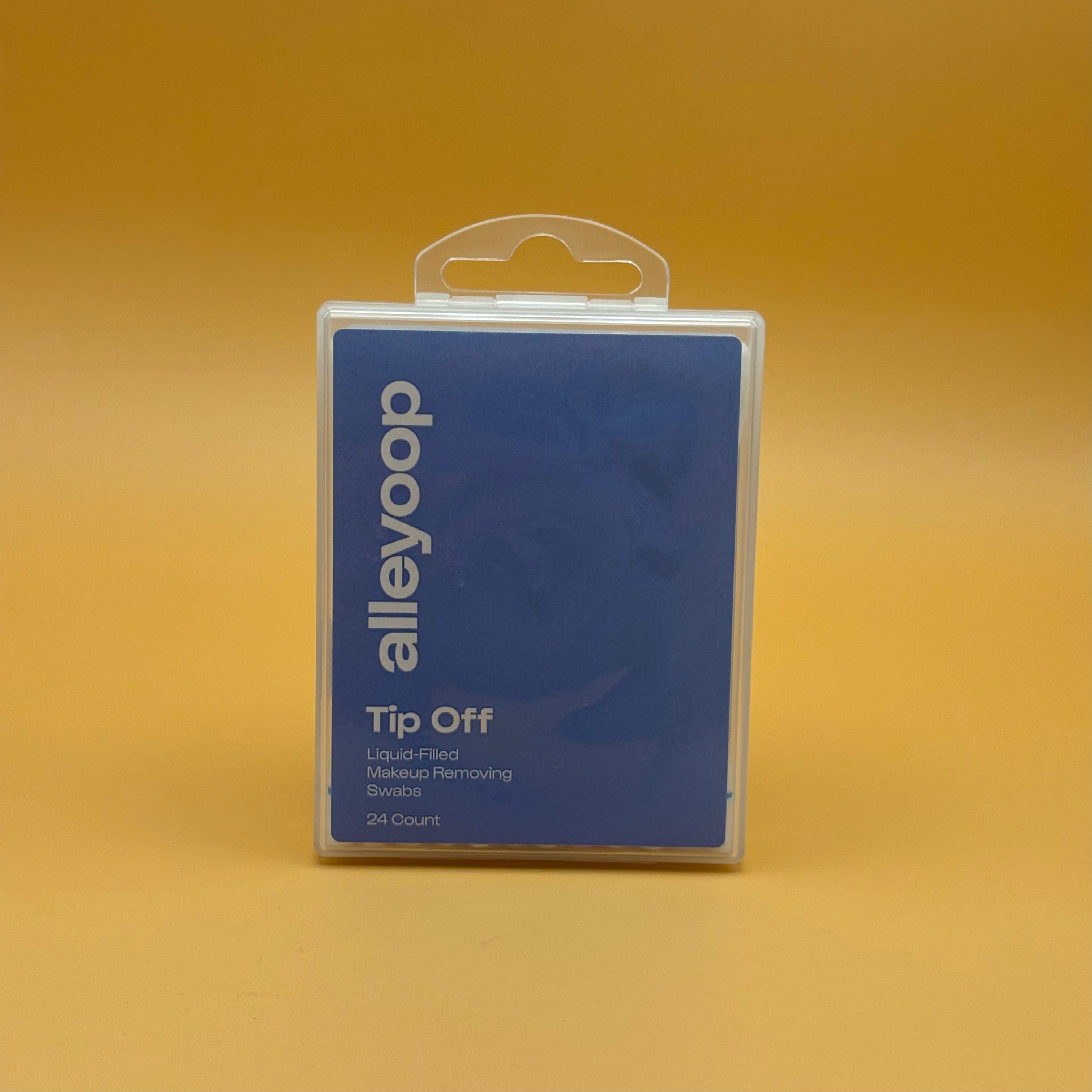 Packaged makeup removing product with 'alleyoop' branding on a yellow background