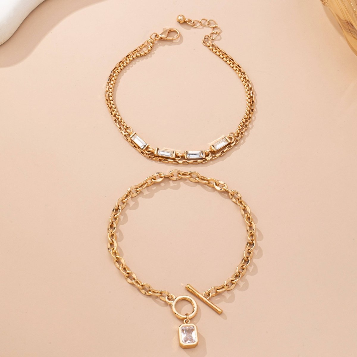 Layered gold-tone necklace with baguette crystals and toggle clasp