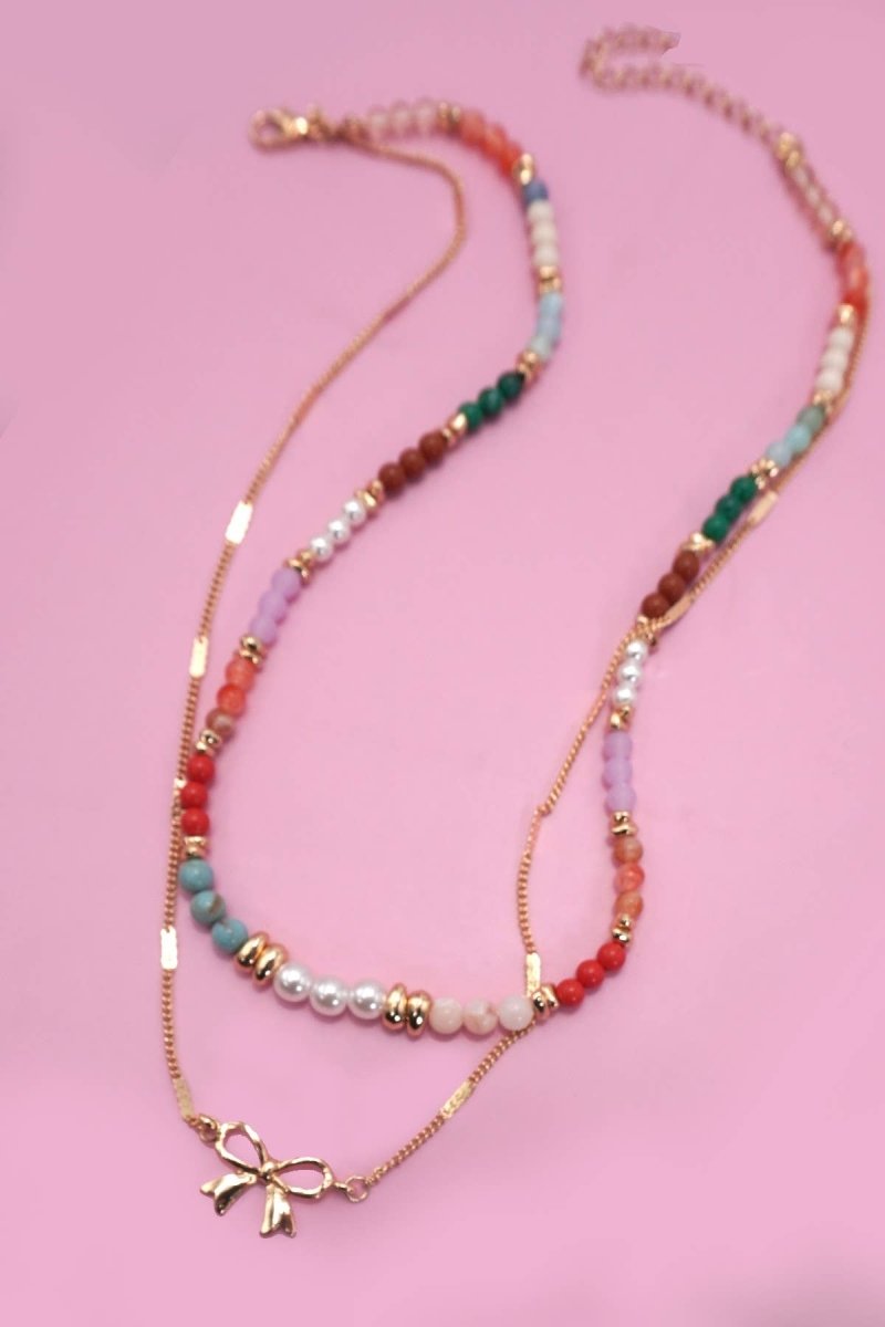 Double layer beaded necklace with heart and bow charm