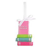 Enamel-coated bookworm ornament with a grosgrain ribbon hanger