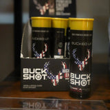 Buck Shot energy drink cans in a display with a blurred background