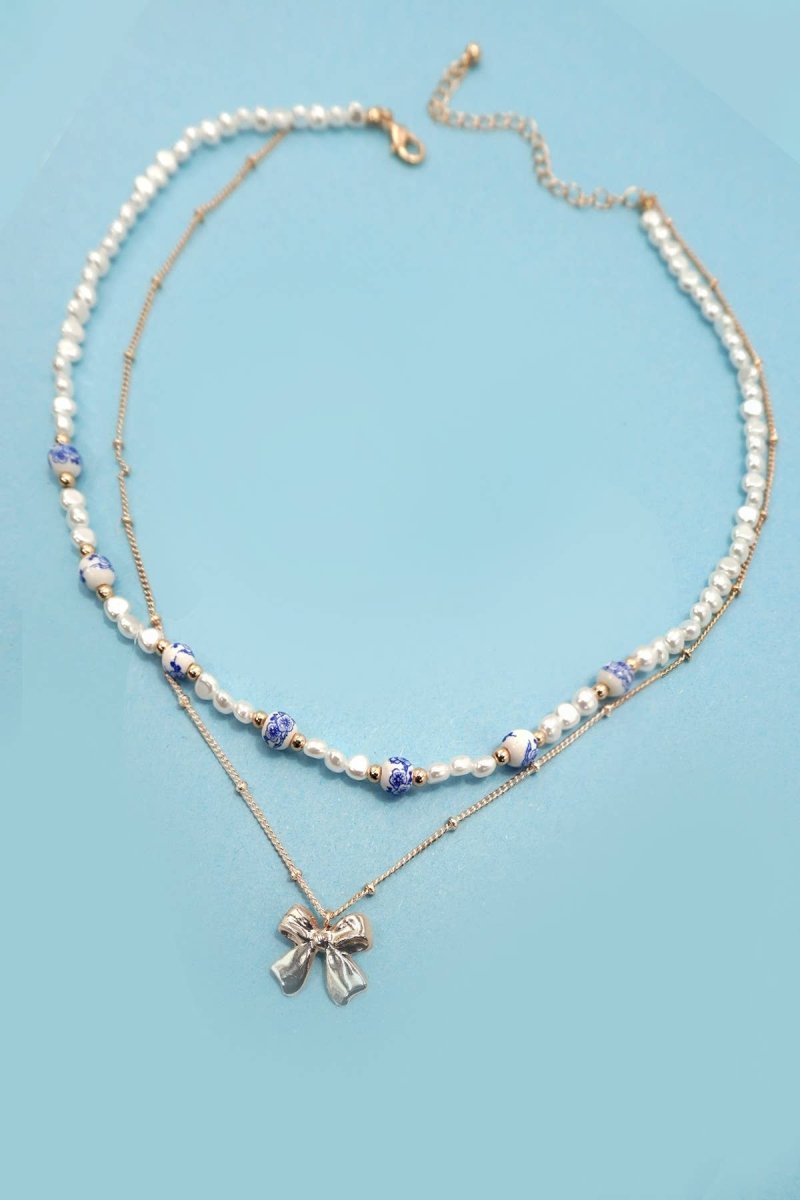 Blue ceramic porcelain pearl necklace with layered bow charm