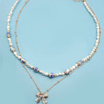 Blue ceramic porcelain pearl necklace with layered bow charm