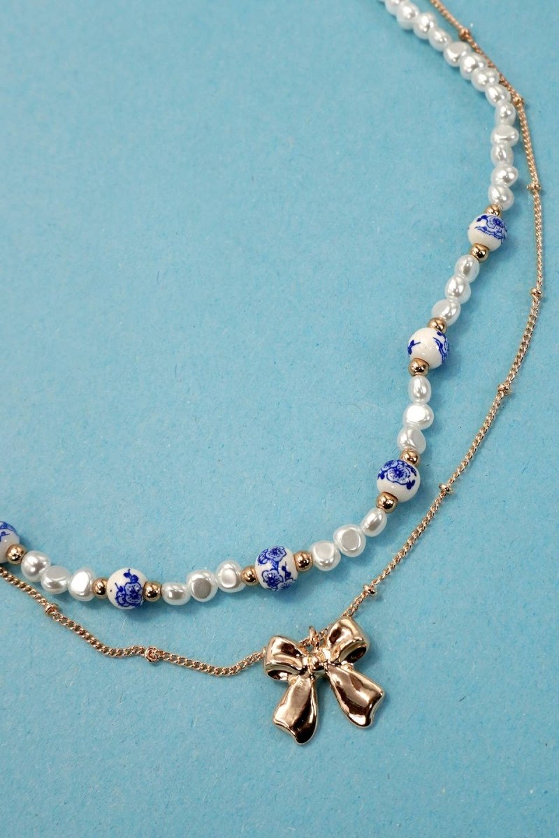 Blue ceramic porcelain pearl necklace with layered bow charm