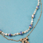 Blue ceramic porcelain pearl necklace with layered bow charm