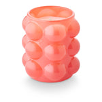 Coconut Milk Mango scented candle in a bubble-textured glass vessel