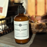 Bottle of all-natural clean hands gel on a wooden surface with a blurred background