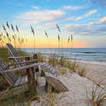 Jigsaw puzzle box for Coastal Sunrise, featuring a pink and gold sunrise over the beach