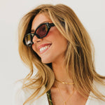 Black cat eye sunglasses with a classic silhouette
