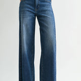 Dark wash wide leg jeans with a raw hem finish