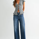 Dark wash wide leg jeans with a raw hem finish