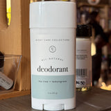 All-natural rowe casa deodorant stick on a wooden surface with blurred background. 