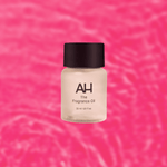 Bottle of Aura House Manifest fragrance oil, an ambery blend of Egyptian musk, amber, and sandalwood