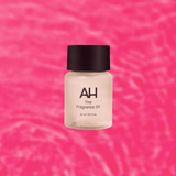 Bottle of Aura House Manifest fragrance oil, an ambery blend of Egyptian musk, amber, and sandalwood