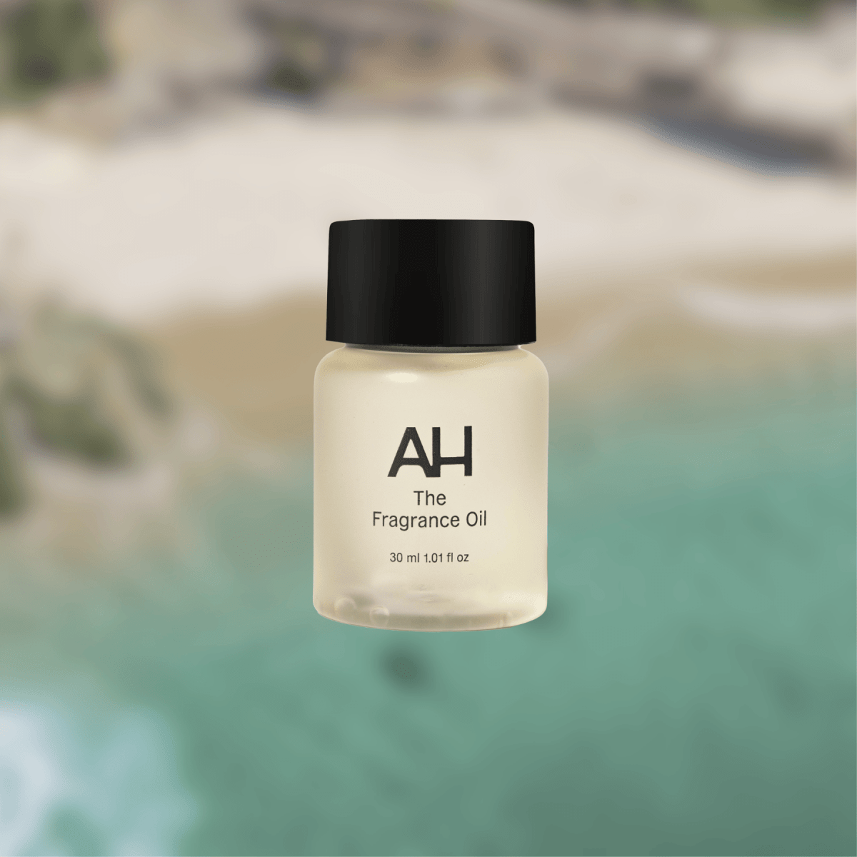 Bottle of Aura House Coast fragrance oil, inspired by Laguna Beach with lemon, rose, and sandalwood notes