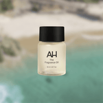 Bottle of Aura House Coast fragrance oil, inspired by Laguna Beach with lemon, rose, and sandalwood notes