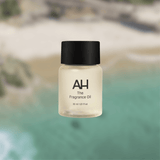 Bottle of Aura House Coast fragrance oil, inspired by Laguna Beach with lemon, rose, and sandalwood notes