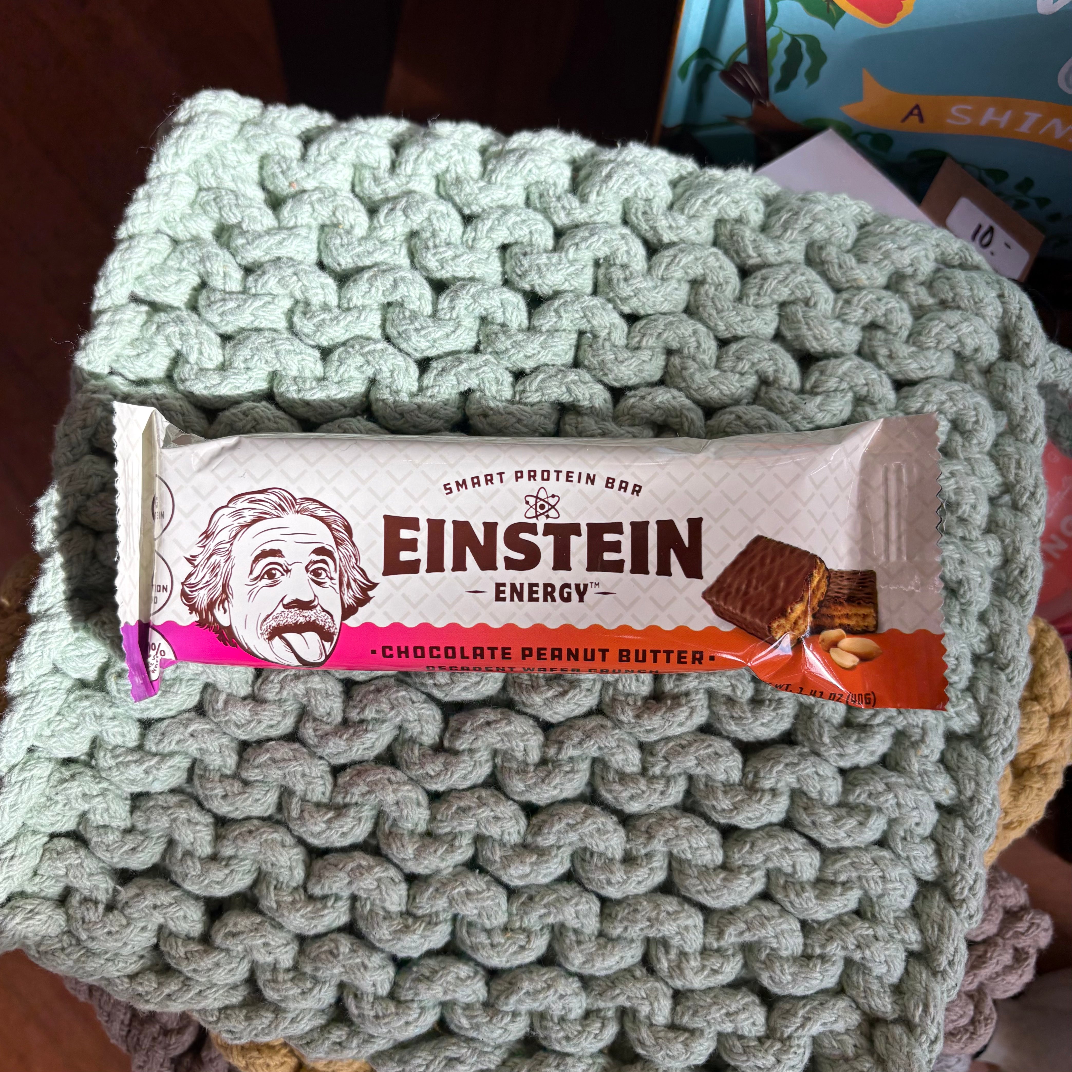 Einstein Energy protein bar on a knitted surface