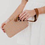 Black woven vegan leather clutch with a wristlet strap