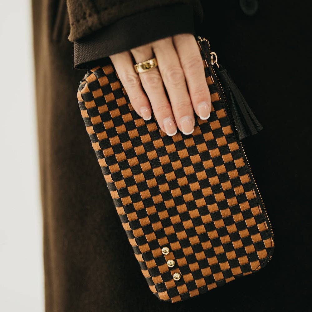 Black woven vegan leather clutch with a wristlet strap