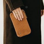 Black woven vegan leather clutch with a wristlet strap