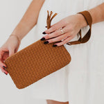 Black woven vegan leather clutch with a wristlet strap