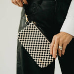 Black woven vegan leather clutch with a wristlet strap
