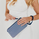 Black woven vegan leather clutch with a wristlet strap