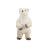 Standing polar bear figure made of faux fur and foam in white and black