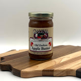 Jar of Galena Canning Company Old Fashion Apple Butter on a wooden cutting board with a white background