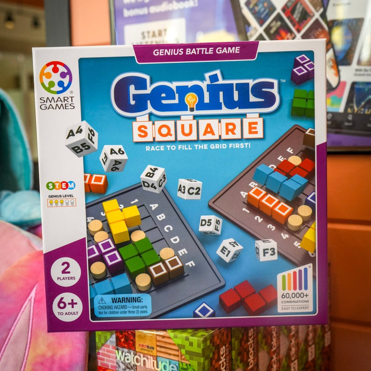 Smart Games Genius Square board game packaging on a store shelf