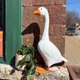 Giddy the porch goose statue on a front porch