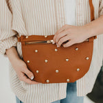 Gold-studded vegan leather bum bag with an adjustable strap