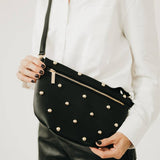 Gold-studded vegan leather bum bag with an adjustable strap