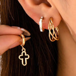 Gold-tone hoop earring trio set with cross and baguette accents