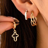 Gold-tone hoop earring trio set with cross and baguette accents