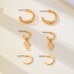 Gold-tone hoop earring trio set with cross and baguette accents