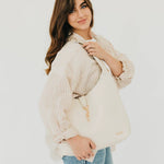 Vegan leather hobo tote bag with an exterior lock
