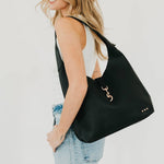 Vegan leather hobo tote bag with an exterior lock